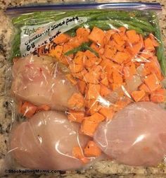 chicken, carrots and onions wrapped in plastic