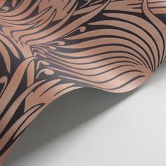 a close up view of an animal print on a piece of paper with brown and black stripes