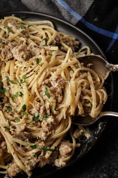 pasta with meat and parsley in a skillet