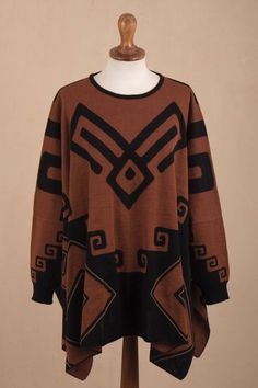 Drawing inspiration from the textiles of the ancient Inca Peruvian artisan Waldo Berrios creates this stunning and lovely poncho. He works with a luxuriously soft alpaca blend knitting this sleeved poncho to feature geometric spiral patterns in contrasting hues of russet and black. Bohemian Jacquard Knit Sweater, Oversized Brown Bohemian Cape, Oversized Brown Bohemian Sweater, Bohemian One-size Acrylic Sweater, Bohemian Alpaca Cape For Fall, Bohemian Alpaca Shawl For Fall, Oversized Brown Bohemian Poncho, One Size Long Sleeve Alpaca Poncho, Brown Long Sleeve One-size Cape