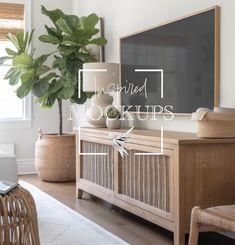 a living room with a plant and a chalkboard on the wall that says inspired mockups