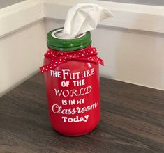 a red mason jar with the words, the future of the world is in my classroom today