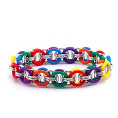 Lightweight and fun to wear, here's a colorful and casual bracelet you can make in a hurry. This listing is for all the materials you need to make our Stretchy Parallel Chain Bracelet.  It's great for beginners because the weave is easy to see and progresses quickly.  You'll have a stretchy and fun bracelet in no time.  Experienced jewelry makers and chain mailers will enjoy the project, too. We include plenty of our handmade, sawcut, bright silver aluminum jump rings and colorful stretchy silic Nickel Free Multicolor Metal Bracelets, Multicolor Nickel Free Metal Bracelets, Multicolor Metal Jubilee Bracelets, Handmade Multicolor Metal Bracelets, Multicolor Metal Bracelets For Friendship, Multicolor Chain Bracelets As Gift, Nickel-free Multicolor Metal Charm Bracelet, Multicolor Hypoallergenic Charm Bracelet, Hypoallergenic Multicolor Metal Bracelets