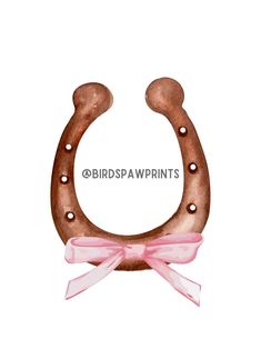 a watercolor drawing of a horseshoe with a pink bow