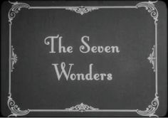 the seven wonders logo in black and white with an ornate frame around it that reads,'the seven wonders '