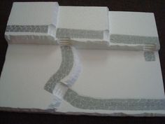 three pieces of paper taped together with white tape on top of each one and the other side