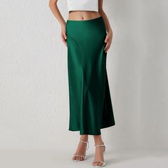 This Seasonal Fave Satin Long Midi Skirt is the new power player in our wardrobe! Features a high waistline, a figure-skimming silhouette with side pleated details for a chic look, and a flowy midi hem Comes in eight colors Made from quality Polyester Available in sizes S-L Model is wearing size S Fitted Midi Skirt Solid Color, Chic Solid Color Maxi Skirt With Lining, Chic Lined Maxi Skirt, Elegant Non-stretch Lined Pencil Skirt, Chic Flowy Skirt In Solid Color, Party Solid Color Pencil Skirt With Lining, Non-stretch Elegant Flared Skirt, Non-stretch Midi Length Skirt, Elegant Non-stretch Flared Skirt