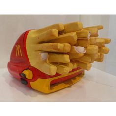 a mcdonald's fast food machine with french fries in the shape of a bus