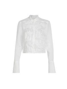 The Patti Ruffle Blouse by TWP is crafted from a cotton-silk blend for a luxurious, lightweight feel. The blouse embraces femininity with its semi-sheer outer and ruffle detailing at the front. It is completed with barrel button cuff sleeves and concealed front button closures. [tab] Composition: 78% cotton, 22% silk Size and Fit: Runs True to Size Care Instructions: Dry Clean Only Origin: Made in USA SKU: TWP49R161-IVO Questions about size, fit, or how to style? The KZ team is here to help you Band Collar Blouse, Ruffle Collar Blouse, White Ruffle Blouse, Organza Blouse, Evening Jumpsuit, Haute Hippie, Ruffle Collar, Band Collar, Crop Shirt