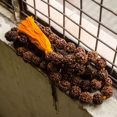 Large 18-20mm Rudraksha half mala necklace 54 Rudraksha seed beads plus one guru bead, hand-knotted by the women of Vrindavan on red or orange (saffron) cotton thread in Vrindavan. Matching cotton tassel. Approximately 44 inches (112cm) long. 5-mukhi Rudraksha beads are soaked in almond oil to condition and darken, but other than that, they are all natural. ********************************************** Recycled sari shopping grocery tote bag sold here! Rudraksha Necklace, Sari Shop, Knotted Mala, Rudraksha Beads, Grocery Tote Bag, Bone Necklace, Silver Caps, Grocery Tote, Mala Necklace