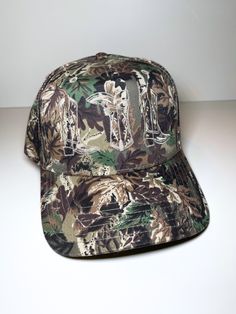 Embroidered camo canvas trucker hat in cream One size fits most - adjustable velcro closure Khaki Trucker Baseball Cap For Outdoor, Khaki Trucker Hat For Outdoor, Khaki Military Style Trucker Hat, Camouflage Trucker Baseball Cap With Flat Bill, Khaki Trucker Baseball Cap With Curved Brim, Khaki Trucker Cap With Curved Brim, Military Style Khaki Snapback Trucker Hat, Military Style Khaki Trucker Hat Snapback, Camouflage Trucker Baseball Cap