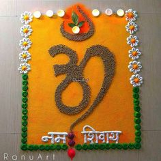 a decorated sign with flowers and candles in the shape of an om shanti symbol