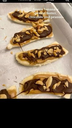 chocolate covered pretzels with peanut butter and peanuts on them are ready to go into the oven