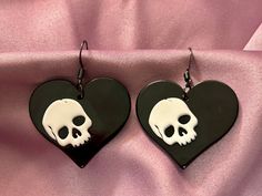 These acrylic earrings feature a black heart and white skull. All earrings are made with stainless steel hooks or studs and are hypoallergenic. Punk Heart-shaped Earrings, Punk Heart-shaped Pierced Earrings, Gothic Black Heart-shaped Earrings, Black Emo Earrings For Gift, Black Skull Earrings For Gift, Black Skull Print Earrings As Gift, Black Skull-shaped Earrings With Skull Print, Black Gothic Earrings With Skull Print, Black Hook