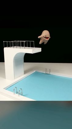 a small swimming pool with an object floating above it