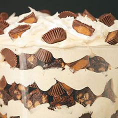 a close up of a cake with white frosting and chocolate chips on it's top