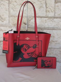 Coach Disney Mickey Mouse X Keith Haring MATCHING Bag + Wallet SET! Includes: Mollie Tote Electric Red Multi & Wallet Matching SET. New With Tags.  Tote Retail $498.00 + tax + Wallet: $228+ tax+$756 + Selling the Matching SET for $359 We will ship your package next business day or same day when we are able. Brand New with Tags and always 100% Authentic.  We all come in different shapes, sizes and with our own unique curves!!! Please check measurements and model pictures. The model is approximate Coach Disney, Disney Handbags, Polished Pebble, Red Tote, Celine Luggage Bag, Zip Wallet, Model Pictures, Disney Mickey Mouse, Disney Mickey