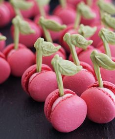 pink macaroni and cheese balls with green leaves on them