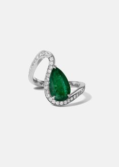 - The Trace Collection The Emerald Diamond Trace Pavé Ring is crafted of polished 18 karat gold, showcasing a fluid line of diamonds that delicately dances around the finger with a nestled 1.6ct pear cut emerald. 1.6ct emerald | approx 0.45tcw diamonds Custom variations can be made with alternative stone sizes. For inquiries: bespoke@katkimfinejewelry.com Available in Yellow Gold, White Gold — Platinum upon request. Please note: All our pieces are made to order and requires 2-4 weeks for product Formal Pear-shaped Emerald Ring In White Gold, Fine Jewelry Pear-shaped Emerald Ring Vvs Clarity, Fine Jewelry Pear-shaped Emerald Ring With Vvs Clarity, Luxury Pear-shaped Diamond Ring With Pavé Setting, Luxury Pear-shaped Rings With Pave Setting, Teardrop Platinum Diamond Ring For Formal Occasions, Formal Teardrop Platinum Ring, Teardrop Brilliant Cut Emerald Wedding Ring, Elegant Emerald Diamond Pear-shaped Ring