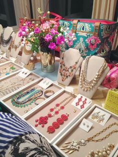 a table filled with lots of different types of jewelry