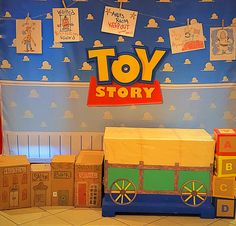 a toy story display with cardboard boxes and toys