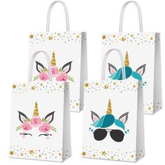 four unicorn bags with flowers and sunglasses on them