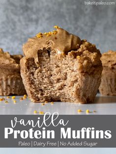 vanilla protein muffins with chocolate frosting and sprinkles on top