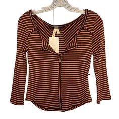 Elevate Your Wardrobe With This Stylish Free People Blouse In Navy And Orange Stripes. The Henley Neckline With A Pullover Closure Adds A Touch Of Sophistication, Making It Perfect For A Party, A Casual Day Out Or Even Workwear. The Blouse Is Made Of A Breathable Knit Fabric With A Comfortable Regular Fit That Flatters Your Curves. The Blouse Features Long Casual Sleeves With Button Accents And A Striped Pattern That Adds A Vintage Charm To The Overall Look. It Is Machine Washable And Made Of A Trendy Orange Fall Tops, Orange Long Sleeve Top With Buttons, Orange Buttoned Tops For Spring, Orange V-neck Top With Buttons, Spring Orange Tops With Buttons, Orange Tops With Buttons For Fall, Orange Buttoned Tops For Fall, Fall Orange Tops With Buttons, Fitted Orange Tops For Work