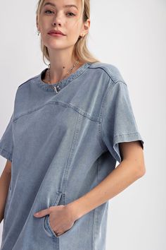 Details Brand: Easel Denim Tunic Dress Mineral Wash Panel Detailing Rounded Neckline Slightly Dropped Shoulders Short Sleeves Front Pockets Snap Back Button Closure Material and Care 97% Cotton 3% Spandex Hand Wash Cold Hang or Line Dry Measurements of Garment Bust of the garment is measured armpit to armpit and then doubled. Length of the garment is measured from the top of the shoulder to the bottom of the hem line. Sleeve Length of the garment is measured from the top part of the shoulder sea Casual Washed Blue Short Sleeve Denim Dress, Casual Washed Blue Denim Dress With Short Sleeves, Trendy Light Wash Relaxed Fit Denim Dress, Trendy Washed Short Sleeve Denim Dress, Casual Washed Denim Dress With Short Sleeves, Washed Short Sleeve Denim Dress, Casual Medium Wash Mini Length Denim Top, Casual Medium Wash Mini Denim Top, Casual Mini Length Medium Wash Denim Top