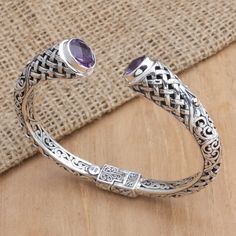 This fabulous creation is one of Balinese artisan Dewi Putera's latest designs. Working in sterling silver, this cuff bracelet features traditional motifs and a combination finish. The final touch is in the faceted amethyst stones totaling over three carats. Amethyst Stones, Traditional Motifs, Final Touch, Balinese