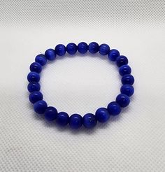 Sapphire blue Luxury Sapphire Jewelry With Gemstone Beads, Luxury Sapphire Beaded Jewelry, Sapphire Beaded Bracelets With Faceted Round Beads, Hand-strung Sapphire Beaded Bracelets, Spiritual Sapphire Hand-strung Beaded Bracelets, Blue Beads, Blue Sapphire, Sapphire, Jewelry Bracelets