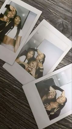 four polaroid photos of three women posing for the camera on top of a wooden table