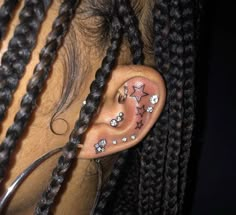 the ear is decorated with stars and beads