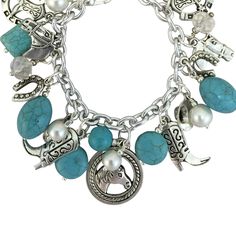 7.5 Inch Equestrian Jewelry Turquoise Magnesite Stone Charm Bracelet. Horse Gifts for Girls The bracelet contains Horse Charms Boot Charms Horseshoe Charms Cowboy Hat Charms Turquoise Magnesite Stone Charms Faux Pearl Charms Clear Crystal Charms on Silver 7.5 Inch Bracelet with Lobster Clasp Adjustable Turquoise Metal Charm Bracelet, Horse Charm Bracelet, Hat Charms, Boot Charms, Manager Table, Charm Bracelet Silver, Turquoise Charm, Equestrian Jewelry, Western Accessories