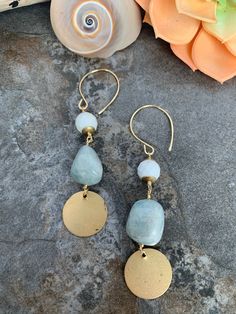 Beachy boho style earrings .. crafted with hand forged ear wires .. faceted White Buffalo Turquoise and tumbled Aquamarine accented with brass coin charms .Thus fun pair measure 3.5 inches in length. Bohemian Amazonite Earrings As Gift, Bohemian Amazonite Earrings For Gifts, Bohemian Hammered Dangle Earrings, Handmade Turquoise Amazonite Earrings, Bohemian Turquoise Hammered Earrings, Bohemian Dangle Jade Jewelry, Dangle Earrings With Amazonite And Natural Stones, Bohemian Jade Dangle Jewelry, Bohemian Round Jade Earrings