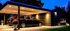 two cars are parked in front of a house at night with lights on the roof