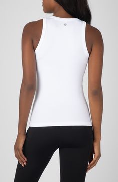 Stock up on essentials with this trio of seamless tank tops crafted from stretchy fabric. Pack of three tank tops Crewneck Sleeveless 92% nylon, 8% spandex Machine wash, tumble dry Imported Micro-elastic Elastane Tops With Moisture-wicking, Micro-elastic Moisture-wicking Elastane Tops, Moisture-wicking Micro-elastic Elastane Top, White Elastane Tank Top With Built-in Bra, Micro-elastic Sleeveless Sports Tops, Sleeveless Micro-elastic Sports Top, Stretch Elastane Moisture-wicking Tank Top, Fitted White Seamless Activewear, White Fitted Seamless Activewear