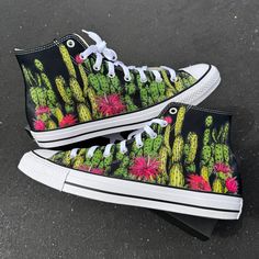 Cactus Garden theme Converse high top chucks. We source each pair of blank shoes brand new directly from Converse. The ink is permanent and will never come off. Made in the USA. This price includes everything: shoes and artwork. Sizes listed are in US sizing scale. If you have any issues with your order, please feel free to reach out to us and we will be more than glad to help you! Note: Blvd Custom is in no way affiliated with any of the shoe brands or companies that are featured on our website. Each pair of shoes is ordered lawfully bought at retail price. Then we are able to print artwork and designs on the shoes to create for our supporters. Because of our customers we are able to help support independent artists and donate to charitable causes through exclusive collection collabs. Converse Shoes Custom, Customized Converse, High Top Chucks, Converse High Top, Black High Top Converse, Halloween Shoes, Nike Converse, High Top Converse, Desert Flowers