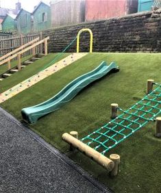 an artificial playground with slide and climbing bars