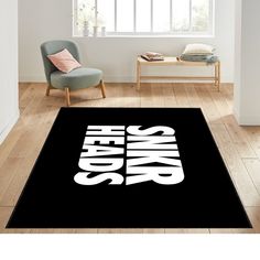 a black rug with the words high school on it in front of a chair and window