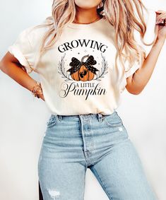 Growing A Little Pumpkin Sweatshirt Fall Maternity Sweater Pregnancy Thanksgiving Shirt Fall Pregnancy Announcement Gift Pregnancy Reveal Sizing and Color Information: Our shirts are made to order specially for you. For this reason, we don't accept returns or exchanges. To ensure the perfect fit, please refer to our color and size charts before placing your order. If you have any questions, don't hesitate to send us a message to clarify sizing or colors. HOW TO ORDER MULTIPLES: 1. Select your size and color in the drop down menus & add to cart! 2. Then simply go back and repeat for each shirt. If you want to add or change anything on the existing design that we show in the display picture, please contact with us. Product Information: (T-shirts and Long Sleeve T-shirts) Solid colors such as Pumpkin Pregnancy Announcement, Halloween Pregnancy Shirt, Thanksgiving Pregnancy Announcement, Halloween Gender Reveal, Fall Pregnancy, Fall Pregnancy Announcement, Gender Reveal Gifts, Pumpkin Sweatshirt, Pregnant Halloween