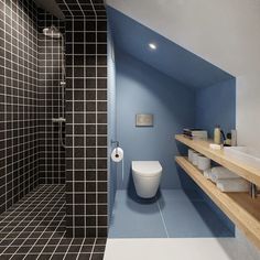 a bathroom with blue walls and black tile