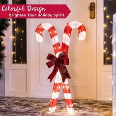 a lighted candy cane standing in front of a door with the words, colorful design brighten your holiday spirit