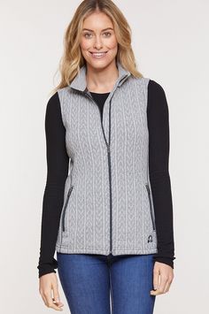 Soft and cozy, the Eva vest serves you indoors or out, and makes a perfect insulating layer under a jacket. A double-face wool-blend lets this lightweight vest work its warmth three seasons of the year, while the cable knit adds femininity and visual appeal. This flattering style includes contrast topstitch, vertical zip pockets, a zip front closure, and a warm standup collar. Cozy Fitted Cable Knit Sweater Vest, Winter Cable Knit Sweater Vest For Layering, Winter Knit Vest Outerwear, Knit Vest Outerwear For Winter, Winter Cable Knit Vest For Layering, Winter Cable Knit Layering Vest, Cable Knit Vest For Winter Layering, Cozy Cable Knit Sweater Vest For Winter, Cozy Cable Knit Outerwear For Layering