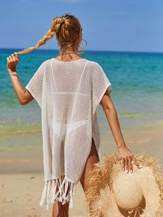 Get ready to set sail in style with our Cruise Oversized Knit Fringe Sweater! This cover-up and quirky sweater is the perfect addition to your summer wardrobe, featuring a playful oversized fit and fun fringe detailing. Stay breath and trendy on your next summer vacation. (Ahoy there, fashionistas!) Size Guide: Model is 5’8” tall, and has a 34.2” bust, 24.9”waist, & 37.7” hips. She is wearing a S / US 4 / AU 8. This sweater is true to size. Material: 100% Polyester. Key Features: V-Neckline. Short sleeve. Coverup. Crochet Knit. Fringe hem. Not lined. Oversized fit. Maternity friendly. No closures. Care Instructions: Machine wash / Cold hand wash Open Knit Poncho For Vacation, Oversized Knit Poncho For Summer, Casual Poncho For Vacation, Oversized Casual Poncho For Vacation, Spring Vacation Knit Poncho, Open Knit Summer Beach Poncho, Summer Beach Open Knit Poncho, Knitted Crew Neck Top For The Beach, Oversized Casual Cover-up For Festival