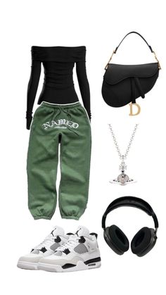 a woman wearing green pants and black top with headphones on her head, holding a purse