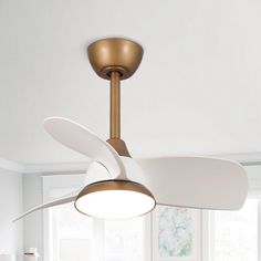 a ceiling fan in a white room