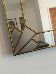 a mirror hanging on the wall in a room