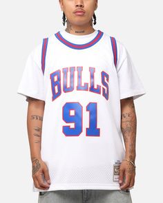 a young man wearing a white bulls jersey with the number 91 on it and tattoos