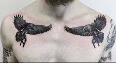 a man with two black birds on his chest